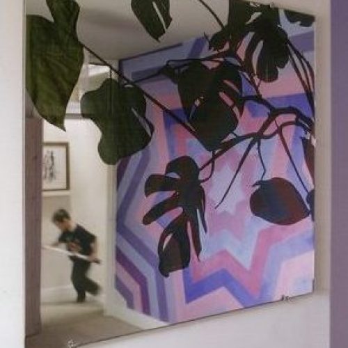 Bedroom with monstera (mirror) and Sol Lewitt inspired geometric wall painting 2008