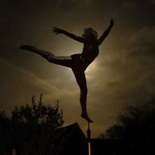 Joyful figure low moon
